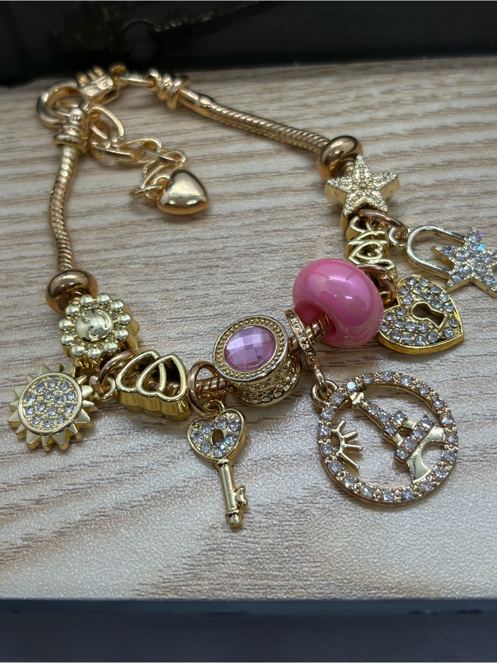 Gold-Tone Charm Bracelet with Pink Glass Bead